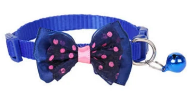 A blue cat collar with a dark blue spotted bow tie and blue bell; colour example; this option contains 1 collar